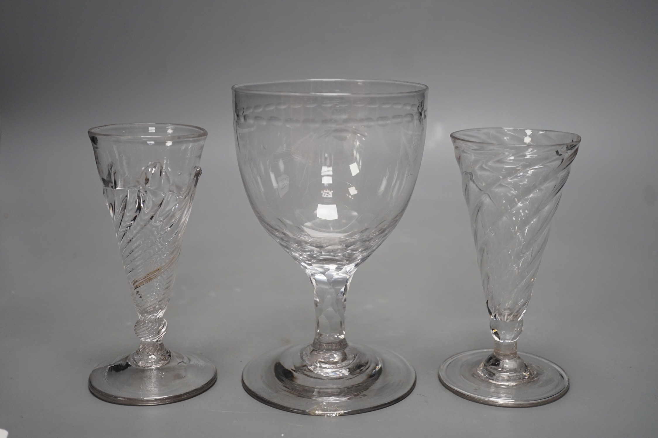 Two wrythen ale flutes, 18th century and a facet stem ‘OXO’ glass rummer, tallest 15cms high